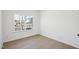 Well lit bedroom featuring hard wood floors and a large window at 556 Contempo Dr # 22, Rolesville, NC 27571