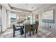 Bright dining room featuring an oval table, elegant chairs, large mirror, and scenic views at 556 Contempo Dr # 22, Rolesville, NC 27571