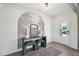 Stylish entryway with decorative wallpaper, console table, mirror, and elegant furnishings at 556 Contempo Dr # 22, Rolesville, NC 27571