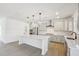 Modern kitchen boasts an island with quartz countertops, stainless steel appliances, and pendant lighting at 556 Contempo Dr # 22, Rolesville, NC 27571