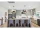 Spacious kitchen with a large center island, gray cabinets, modern appliances, and pendant lighting at 556 Contempo Dr # 22, Rolesville, NC 27571