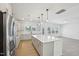 Bright eat-in kitchen features a large island with seating, stainless appliances, and lots of natural light at 556 Contempo Dr # 22, Rolesville, NC 27571