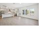 Open-concept kitchen and dining area with stainless steel appliances and access to back porch at 556 Contempo Dr # 22, Rolesville, NC 27571