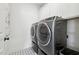 Laundry room with modern appliances and patterned floor at 556 Contempo Dr # 22, Rolesville, NC 27571