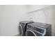 Laundry room featuring side by side front load washer and dryer and wire shelving at 556 Contempo Dr # 22, Rolesville, NC 27571