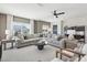Bright living room with a large sectional sofa, ceiling fan and an adjacent workspace at 556 Contempo Dr # 22, Rolesville, NC 27571
