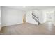 Open living room with staircase and entry to another room at 556 Contempo Dr # 22, Rolesville, NC 27571