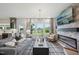 This open concept living room features a fireplace and outdoor patio views at 556 Contempo Dr # 22, Rolesville, NC 27571