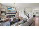 The living room boasts a fireplace, mounted tv, and staircase to the upper floors at 556 Contempo Dr # 22, Rolesville, NC 27571