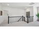 Upstairs loft area features neutral carpet, a black metal railing, and recessed lighting at 556 Contempo Dr # 22, Rolesville, NC 27571