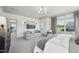 Relaxing main bedroom features neutral decor, a sitting area, and plenty of natural light at 556 Contempo Dr # 22, Rolesville, NC 27571