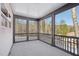 Screened porch with a serene, wooded backyard view at 556 Contempo Dr # 22, Rolesville, NC 27571