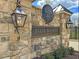 Elegant stone community sign with classic lanterns, showcasing the Norwood Ridge entrance at 5808 Norwood Ridge Dr, Raleigh, NC 27614