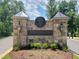 Norwood Ridge community sign featuring stone pillars and classic lanterns by a landscaped entrance at 5808 Norwood Ridge Dr, Raleigh, NC 27614