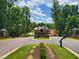 Community entrance to Norwood Ridge with landscaped median and stone sign surrounded by mature trees at 5808 Norwood Ridge Dr, Raleigh, NC 27614