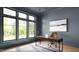 Bright home office with a large window, modern desk, and comfortable chair overlooking green landscaping at 5808 Norwood Ridge Dr, Raleigh, NC 27614