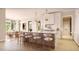 Gourmet kitchen features a large island with seating, white cabinets, pendant lighting, and stainless steel appliances at 5808 Norwood Ridge Dr, Raleigh, NC 27614