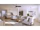 Spacious living room with a pool table, comfortable sofas, chairs, and stylish decor at 5808 Norwood Ridge Dr, Raleigh, NC 27614