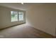 Bright bedroom features carpet, neutral paint and double windows allowing for ample natural light at 6401 Granite Quarry Dr, Raleigh, NC 27610