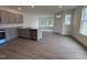 Modern kitchen boasts granite countertops, stainless steel appliances, and seamless open-concept design for easy entertaining at 6401 Granite Quarry Dr, Raleigh, NC 27610
