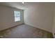 Cozy carpeted bedroom with a large window providing plenty of natural light at 6403 Granite Quarry Dr, Raleigh, NC 27610