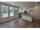 Bright kitchen featuring a central island, white cabinets, and stainless steel appliances at 6403 Granite Quarry Dr, Raleigh, NC 27610