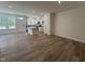 Spacious living room with wood-look flooring that flows into the kitchen and dining area at 6403 Granite Quarry Dr, Raleigh, NC 27610