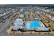 Aerial view of the community pool and amenities including a bathhouse and playground at 6609 Truxton Ln, Raleigh, NC 27616