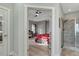 Open doorway leading to a bedroom with a trey ceiling, with access to a shower on the right at 6609 Truxton Ln, Raleigh, NC 27616