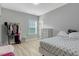 Bright and airy bedroom with hardwood floors, a large window, and ample closet space at 6609 Truxton Ln, Raleigh, NC 27616