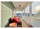 Inviting covered porch with comfortable seating, perfect spot for relaxing and enjoying the neighborhood views at 6609 Truxton Ln, Raleigh, NC 27616