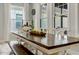 Inviting dining area featuring a long wooden table with white chairs and bench seating at 6609 Truxton Ln, Raleigh, NC 27616