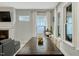 Bright dining area with large windows, plank flooring and long wood table at 6609 Truxton Ln, Raleigh, NC 27616
