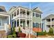 Charming two-story home with inviting double porches, brick accents, and manicured landscaping at 6609 Truxton Ln, Raleigh, NC 27616