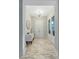 Bright foyer featuring an elegant chandelier and pristine plank flooring at 6609 Truxton Ln, Raleigh, NC 27616