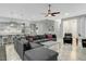 Spacious living room features modern decor, gray couches, and hardwood floors at 6609 Truxton Ln, Raleigh, NC 27616