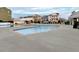 Community pool with a splash pad and seating areas for residents at 6609 Truxton Ln, Raleigh, NC 27616