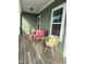 Relaxing porch with comfortable seating and ample natural light at 6609 Truxton Ln, Raleigh, NC 27616