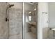 Modern shower with glass enclosure, rain shower head, and decorative tile, an ideal spot to unwind at 6609 Truxton Ln, Raleigh, NC 27616