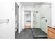Sleek bathroom boasts a glass-enclosed shower, stylish vanity, and convenient access to a walk-in closet at 721 Jones Ferry Rd, Chapel Hill, NC 27516