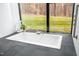 Relaxing bathroom featuring a modern soaking tub with expansive window views of lush greenery at 721 Jones Ferry Rd, Chapel Hill, NC 27516