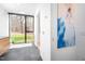 Bright bathroom with a modern soaking tub, wood vanity, and a large window overlooking the backyard at 721 Jones Ferry Rd, Chapel Hill, NC 27516