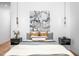 Relaxing bedroom featuring stylish lighting fixtures, a comfortable bed, and elegant decor at 721 Jones Ferry Rd, Chapel Hill, NC 27516