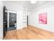 Bright bedroom with a modern painting, closet and an ensuite bathroom with a glass enclosed shower at 721 Jones Ferry Rd, Chapel Hill, NC 27516
