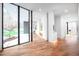 Bright foyer featuring hardwood floors, recessed lighting, and large glass windows with views of the yard at 721 Jones Ferry Rd, Chapel Hill, NC 27516