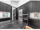 Modern kitchen features stainless steel appliances, dark cabinets, and marble countertops at 721 Jones Ferry Rd, Chapel Hill, NC 27516