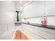 Bright pantry featuring custom cabinets, granite counters, and under-cabinet lighting for a modern look at 721 Jones Ferry Rd, Chapel Hill, NC 27516