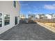 Rear patio area with an outdoor grill surrounded by a fenced-in yard and neighboring homes at 7331 Livestock Rd, Mebane, NC 27302