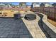 Backyard with custom patio and outdoor fireplace with a privacy fence providing ample space for relaxation at 7331 Livestock Rd, Mebane, NC 27302