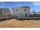Large backyard features a stone patio, green space, and manicured landscaping for outdoor enjoyment at 7331 Livestock Rd, Mebane, NC 27302